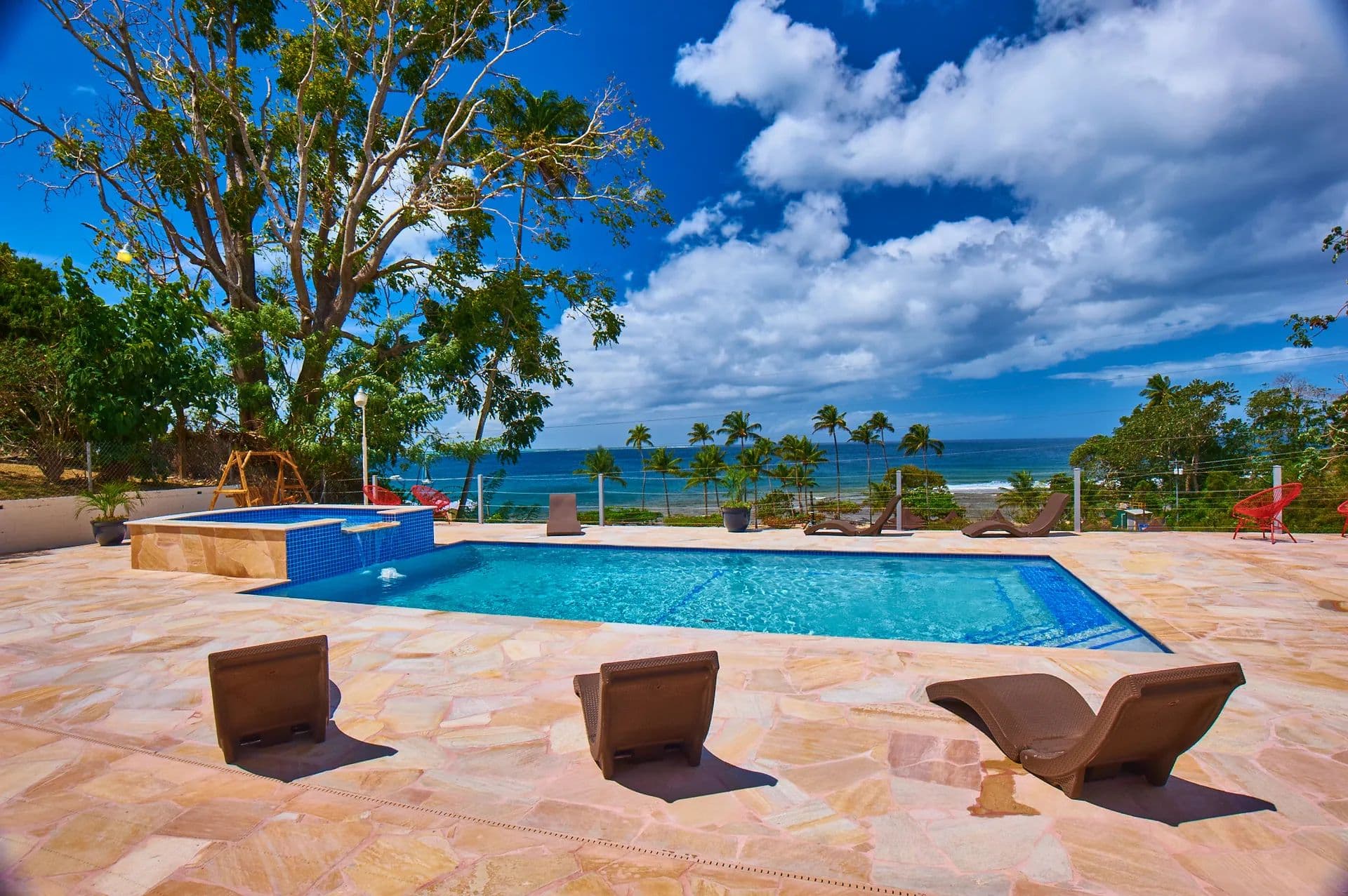 Pool, jacuzzi and the sea beyond at Surfers' Paradise